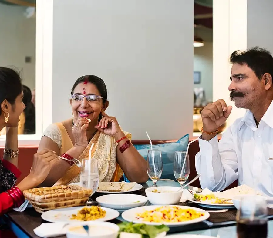 Indian Family having dinner in the restaurant